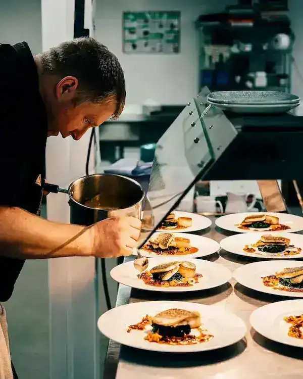Executive Chef preparing a signature gourmet dish